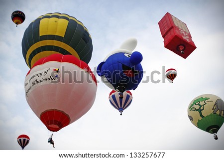 PUTRAJAYA, MALAYSIA - MARCH 28: Hot air balloons taking off at the 5th Putrajaya International hot air balloon fiesta in Putrajaya on March 28, 2013 in Putrajaya, Malaysia.