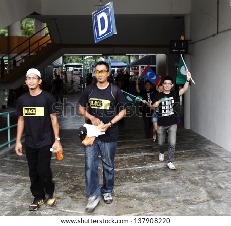 PETALING JAYA, MALAYSIA - MAY 8: Protester walks into the venue of a political rally against Malaysia 13th general election vote result on May 8, 2013 in Stadium MBPJ, Petaling Jaya, Malaysia.