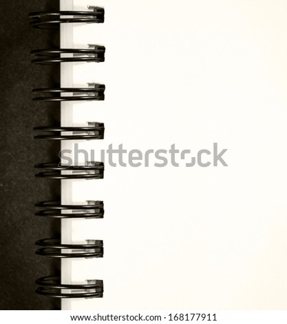 A blank notepad of a ring booklet, with copyspace for text.