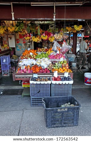 AIR ITAM, PENANG, MALAYSIA - JANUARY 2, 2014: A traditional fruit stall in the Rifle Range wet market. Penang traditional lifestyle is part of the UNESCO world heritage.
