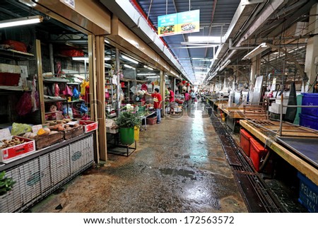 AIR ITAM, PENANG, MALAYSIA - JANUARY 3, 2014: Shoppers in Air Itam wet market. The vintage wet market is at the foothilll of South East Asia largest Buddhist temple called Kek Lok Si Temple.