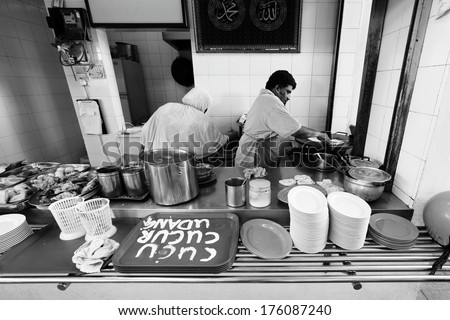 GEORGE TOWN, PENANG, MALAYSIA - JAN 1, 2014: Traditional Indian Muslim food stall in Lorong Swatow. Penang is listed as the top culinary spot for 2014 by Lonely Planet, a renowned travel guide.