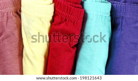 A row of folded colorful laundry fabric underwear.