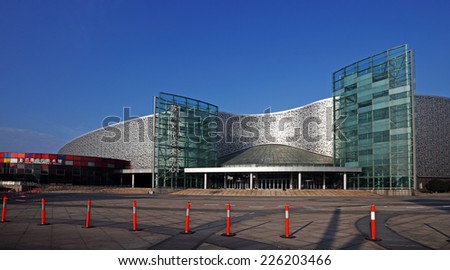 SUZHOU, CHINA - OCTOBER 19, 2014: Facade of the Suzhou Culture and Arts Centre in Jinji Lake East, Suzhou City, China. The center is the permanent home to China annual Golden Rooster Cinematic Awards.