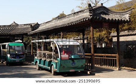 TONGLI, CHINA - JANUARY 2, 2015: Modern electric tourist bus in the ancient town of Tongli, China. The town is placed under China National Key Cultural Relic Protection Unit.