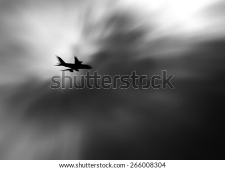 Silhouette of an airplane in the vortex of a psychedelic storm cloud.