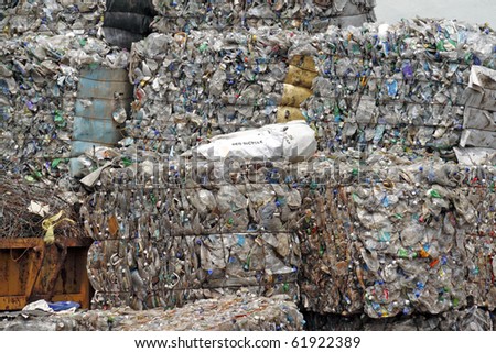 Compacted recyclable plastic and paper waste at a recycling plant.