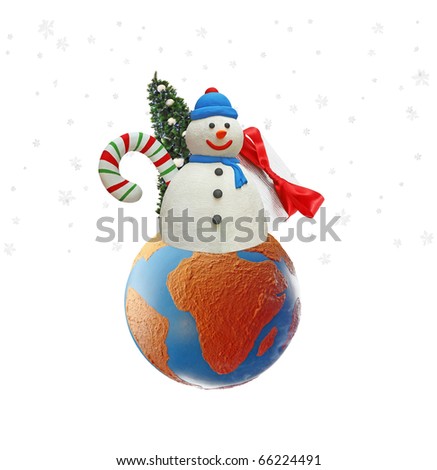 An isolated cutout of a Snowman with a Christmas tree, presents and candy cane on a earth globe with snow flakes falling around it.