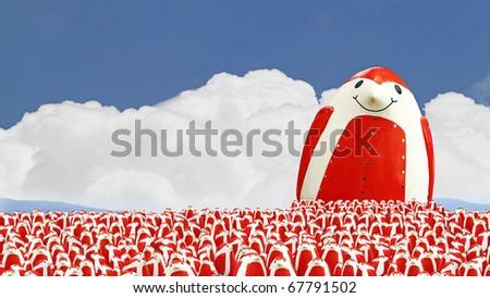 An image of a cute smiling giant red colored psychedelic penguin walking amongst a large colony of its sibling.