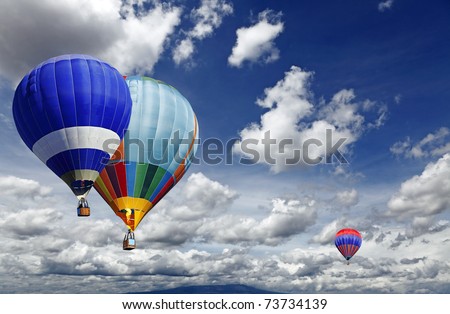 Hot air balloon sporting activity on a fresh blue day.