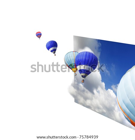 Hot air balloons floating out of an imaginary sheet of dramatic blue cloudy sky with copyspace for text.