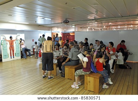 PORT KLANG, MALAYSIA - OCTOBER 1:Visitors at the MV Logos Hope rest lounge on October 1, 2011 in Port Klang, Malaysia. The 132.5m long ship host the world\'s biggest floating book fair with 5000 title
