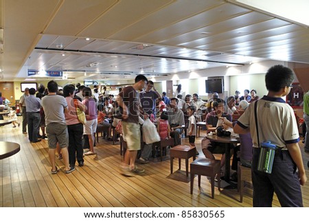 PORT KLANG, MALAYSIA - OCTOBER 1:Visitors at the MV Logos Hope cafe on October 1, 2011 in Port Klang, Malaysia. The 132.5m long ship host the world\'s biggest floating book fair with 5000 book title.