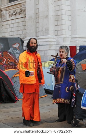 LONDON - NOVEMBER 1: Protestors in religious outfit at the Occupy London Stock Exchange anti-capitalist protest on November 1, 2011 at St Paul's Cathedral churchyard in London, England.
