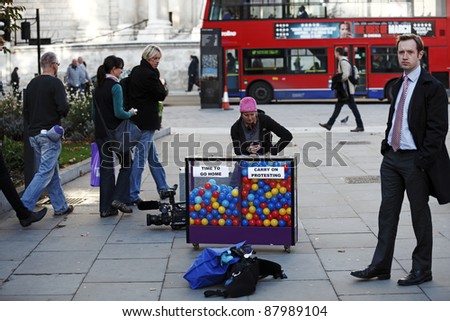 LONDON - NOVEMBER 1: The Media with a poll box on the support for the Occupy London Stock Exchange anti-capitalist protest on November 1, 2011 at St Paul\'s Cathedral in London, England.