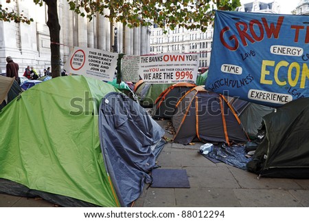 LONDON - NOVEMBER 1: Protestors\' tents with protest banners at the Occupy London Stock Exchange anti-capitalist protest on November 1, 2011 at St Paul\'s Cathedral churchyard in London, England.