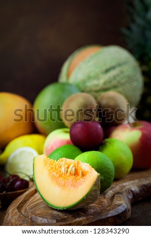 Organic Fruit variety on wood. Tropical exotic food concept.