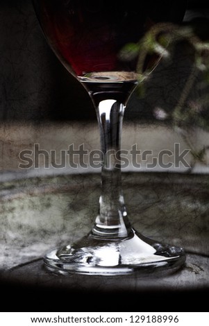 Red wine. Vintage textured photo with glass of red vine