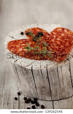 Chorizo salami sausage on  rustic background. Meat cold cuts.