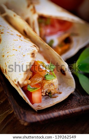 Mexican food. Fresh tortilla fajita wraps with chicken and vegetables