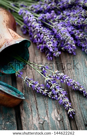 Fresh lavender over wooden background. Summer floral background with lavender flowers and wood.