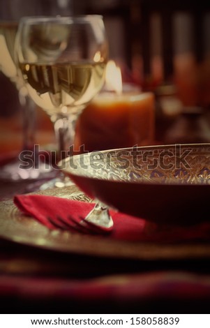 Restaurant autumn table setting. Place setting with oriental plates and autumn decoartion.