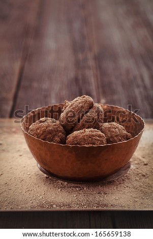 Chocolate truffles. Vintage food dessert with cocoa and nuts