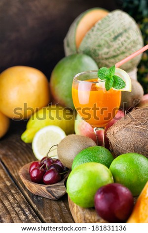 Fruit juice. Organic Fruit variety on wood. Tropical exotic food concept.
