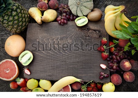 Fresh fruit. Fruit variety on wood. Food background. Tropical fruit