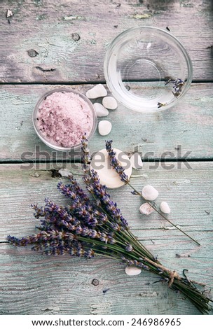 Spa and wellness setting with lavender flowers, floral water and bath salt. Dayspa nature set