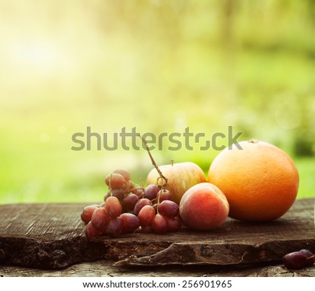Fresh fruit. Fruit variety on wood. Food background. Tropical fruit