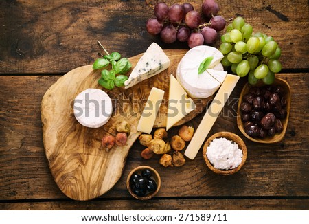 Cheese variety.Food background.  Fresh ingredients on wood