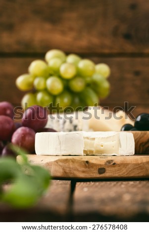Cheese variety.Food background.  Fresh ingredients on wood