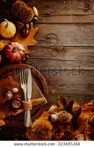 Thanksgiving dinner. Autumn fruit with plate and cutlery. Thanksgiving autumn background