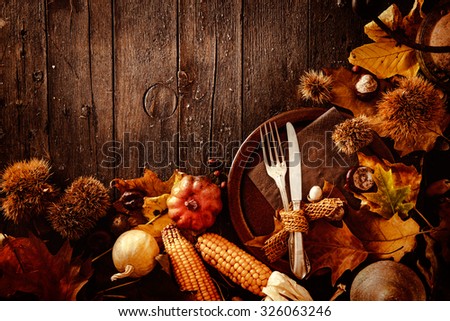 Thanksgiving dinner. Autumn fruit with plate and cutlery. Thanksgiving autumn background