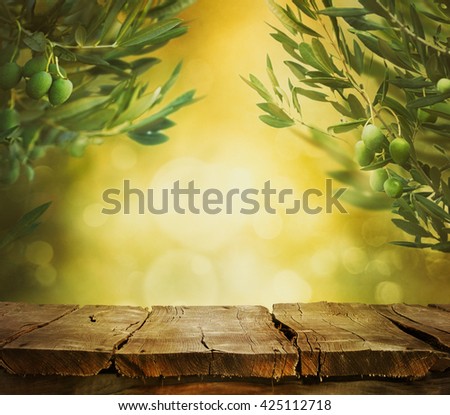 Olives background. Olives on olive tree with bokeh. food background