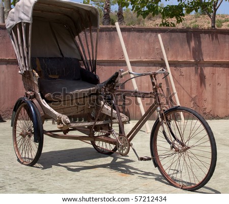 Old indian bicycle with cart in the yard