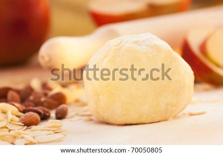 Apple pie ingredients. Dough, apple slices and almonds.