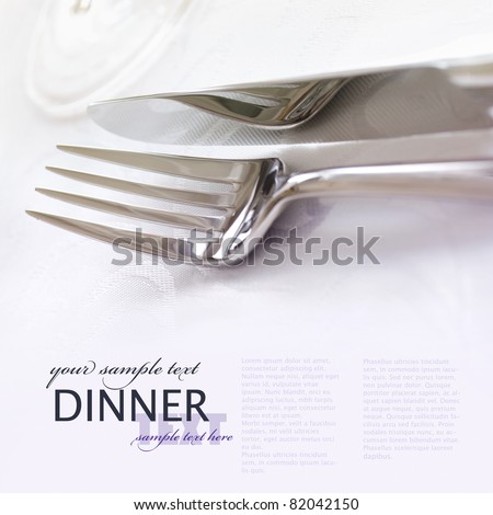 Restaurant menu series. Wedding or dinner table place setting. Fork and knife and glass in elegant  setting with copyspace