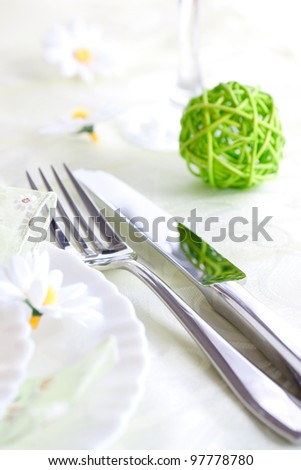 Spring table setting with flowers and decoration