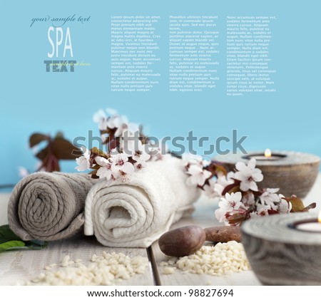 Spa and wellness setting with natural soap, candles and towel. Beige dayspa nature set with copyspace