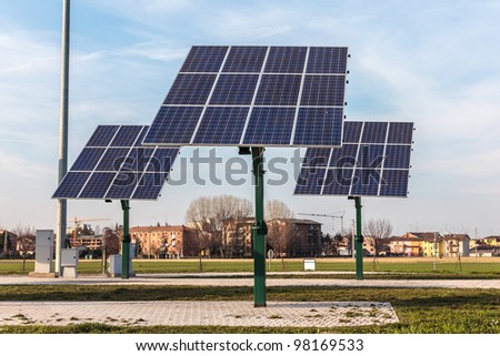 real solar panel in the middle of land on sky and building background