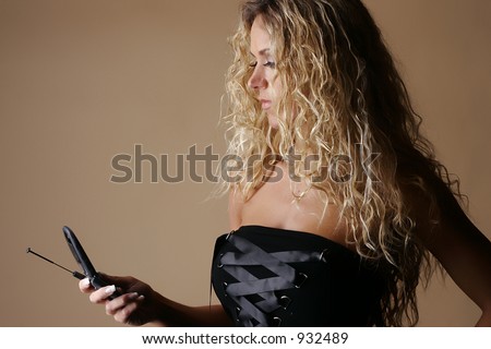 Female model looking at cell phone screen