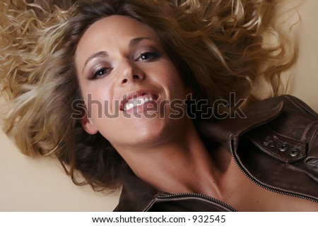 Female model smiling on the ground