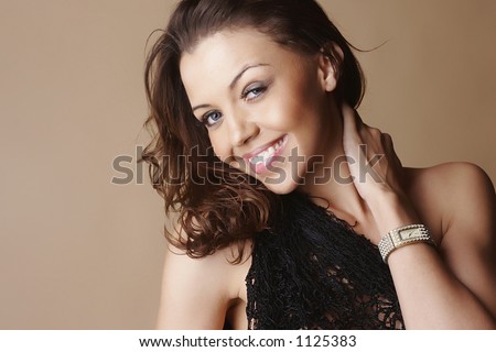 Attractive female model smiling and wearing a watch
