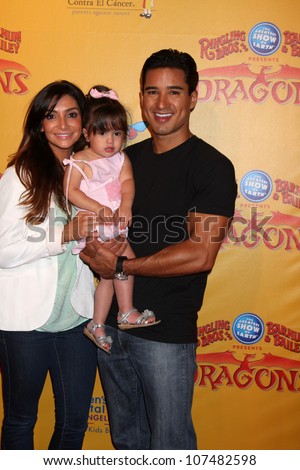 LOS ANGELES - JUL 12:  Courtney Mazza, Mario Lopez and their daughter arrives at 'Dragons' presented by Ringling Bros. & Barnum & Bailey Circus at Staples Center on July 12, 2012 in Los Angeles, CA