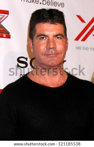 LOS ANGELES - DEC 6:  Simon Cowell arrives to the X Factor 2012 Final Four Party at Rodeo Drive on December 6, 2012 in Beverly Hills, CA