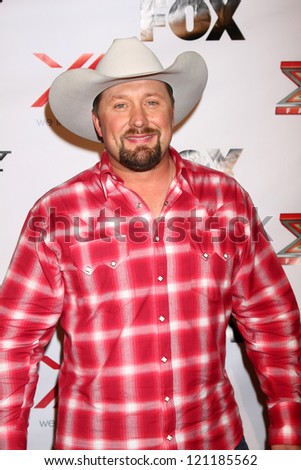 LOS ANGELES - DEC 6:  Tate Stevens arrives to the X Factor 2012 Final Four Party at Rodeo Drive on December 6, 2012 in Beverly Hills, CA
