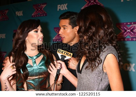 LOS ANGELES - DEC 20:  Demi Lovato, Mario Lopez, Terri Seymour at the \'X Factor\' Season Finale at CBS Television City on December 20, 2012 in Los Angeles, CA