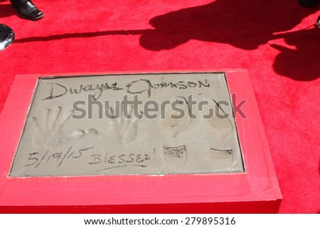 LOS ANGELES - MAY 19:  Dwayne Johnson hand and footprints at the Dwayne Johnson Hand and Foot Print Ceremony at the TCL Chinese Theater on May 19, 2015 in Los Angeles, CA